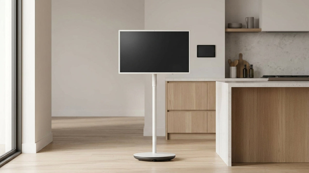 Rolling smart display used as a household command center beside a wall tablet comparison.