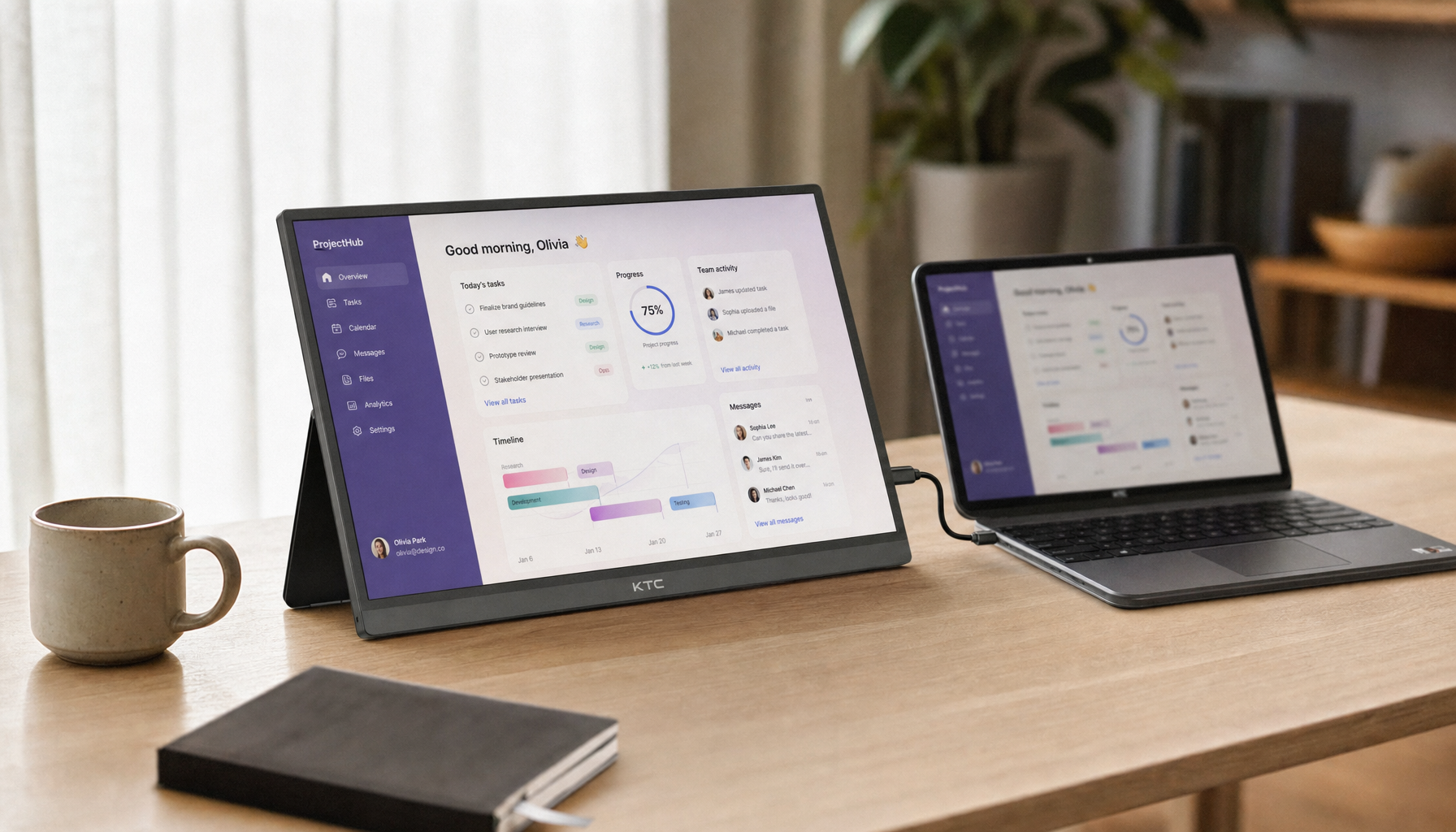 Portable touchscreen monitor connected to a Chromebook laptop via USB-C on a clean desk setup
