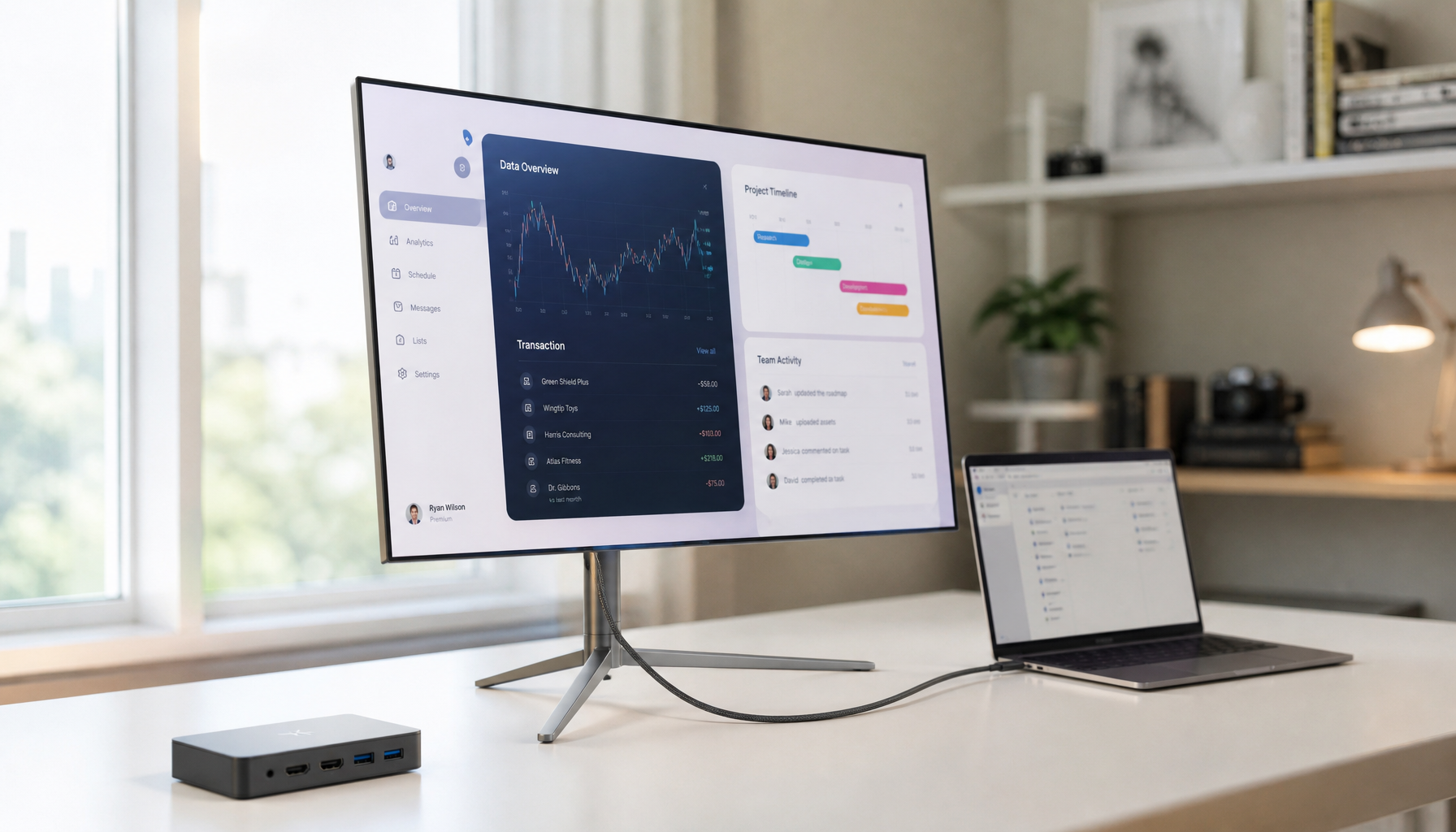 USB-C monitor connected directly to a laptop on a clean desk, with a dock unplugged to the side